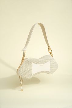 Shoulder bag in Woven Natural Raffia and Nappa Leather Trim and Hanging Organic Rings Designer Beige Shoulder Bag Fashion Accessory, Chic Natural Shoulder Bag, Elegant Straw Bag With Gold-tone Hardware For Daily Use, Elegant Rectangular Straw Bag With Detachable Strap, Luxury Evening Straw Shoulder Bag, Elegant Straw Bag With Gold-tone Hardware For Travel, Luxury Rectangular Baguette Bag As Fashion Accessory, Luxury Straw Shoulder Bag With Removable Pouch, Chic Rectangular Straw Bag With Pearl Handle