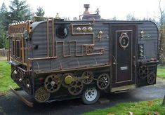 an old train car is for sale on the side of a road with trees in the background