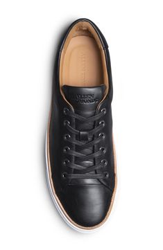 Minimal styling gives work-to-weekend versatility to this elevated sneaker designed for all-day comfort and great durability. Round toe Lace-up style Leather upper, rubber sole Imported Low-top Work Sneakers With Rubber Sole, Workwear Sneakers With Textured Sole And Lace-up Design, Workwear Lace-up Sneakers With Textured Sole, Casual Low-top Workwear Sneakers, Casual Low-top Sneakers For Work, Modern Work Sneakers With Round Toe, Modern Workwear Sneakers With Round Toe, Modern Work Sneakers With Plain Toe, Modern Workwear Sneakers With Plain Toe