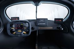 the interior of a car with electronic controls and steering wheel controls on it's dashboard