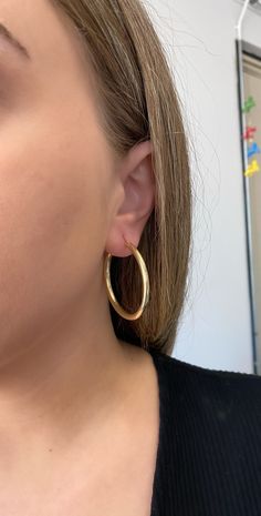 14k solid gold hoop earrings. 2.25 inch hoops. Material: Genuine 14k solid gold. Length: approximately 2.25 inches long. Width: approximately 3.5mm wide. Weight: approximately 5 grams. Comes in a nice box. Classic Round Hoop Earrings In 14k Gold Filled, Classic Round 14k Gold Filled Hoop Earrings, Classic 14k Gold Filled Round Hoop Earrings, Yellow Gold Small Hoop Jewelry, Classic Small Hoop Jewelry Stamped 14k, Classic 14k Small Hoop Jewelry, Cadmium-free Jewelry For Formal Occasions, Classic Hoop Single Earring, 14k Gold Hoop Earrings Stamped 14k