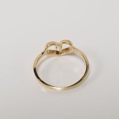 "Thanks for shopping our vintage estate store. We tend to sell well below wholesale and truly hope you enjoy all of our items. Many of the items are one of a kind, so please enjoy scrolling through the pictures and hopefully something will catch your eye. Brown spots are from camera. Estate 10k yellow gold .02ct cz diamond heart baby ring. Ring size: 2 CZ Diamond: .02ct Inside ring: 13.3mm Setting: 6mm 1/4\" Band width: 1.5mm Weight: .64 gram Very sweet ring. Marked 10k." 14k Yellow Gold Heart Cut Birthstone Ring, Valentine's Day Gold Diamond Ring With Prong Setting, Gold Heart-shaped Diamond Ring With Prong Setting, Heart-shaped Gold Diamond Ring With Prong Setting, Classic Yellow Gold Heart Ring With Birthstone, Classic Gold Heart-shaped Diamond Ring, Gold Heart-shaped Diamond Ring For Anniversary, Dainty Gold Heart Ring With Diamond Accents, Gold Heart Ring With Diamond Accents