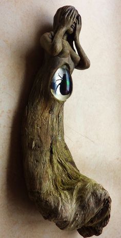 an eyeball in the shape of a tree trunk