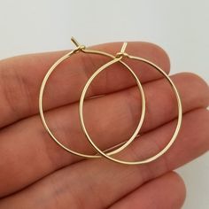 Lovely 18 gauge, Solid 14k Gold Hoop Earrings1.25" size photographed; 2" size shown in videoMETAL: Solid 14k Yellow GoldWIRE GAUGE/DIAMETER: 18 gauge (1.0mm) wire - Slightly thicker than standard ear wire thicknessEARRING DIAMETER SIZE: Approximately 3/4", 1", 1.25" (Pictured), 1.5", 1.75", 2", 2.25", 2.5" -OR- 3" diameter.  Choose the size that is right for you!NOTE: Please review all listing photos, ArisDesignsJewelry Policies and FAQ sections prior to purchase.Find the full selection of 14k, Nickel-free 14k Gold Hoop Jewelry, Minimalist Hoop Jewelry As Gift, Minimalist Hoop Jewelry Gift, Classic Small Hoop Jewelry For Gifts, Classic Small Hoop Jewelry For Gift, Tarnish Resistant Hoop Jewelry Gift, Yellow Gold Hoop Jewelry As Gift, Yellow Gold Hoop Jewelry Gift, Gift Yellow Gold Hoop Jewelry