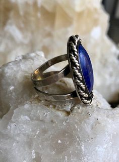 Sterling Silver Blue Lapis Lazuli Native American Vintage Ring Face of ring measures over 1 inch tall Ring size 8 Handmade Adjustable Lapis Lazuli Rings, Adjustable Lapis Lazuli Gemstone Ring, Adjustable Blue Oval Jewelry, Spiritual Blue Crystal Ring, Bohemian Blue Oval Ring, Blue Lapis Lazuli Oval Jewelry, Blue Bohemian Jewelry With Metal Ring, Blue Opal Spiritual Ring For Gift, Unique Blue Opal Ring