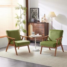 two green chairs sitting next to each other on top of a white carpeted floor