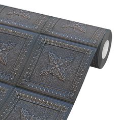 a roll of metallic foil with decorative designs on it