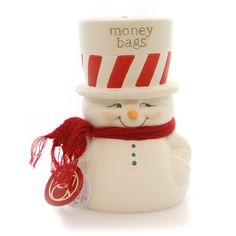 a white snowman with a red scarf around his neck