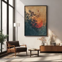 a living room filled with furniture and a painting hanging on the wall above it's coffee table