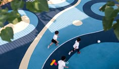 two children are playing with a ball on the playground