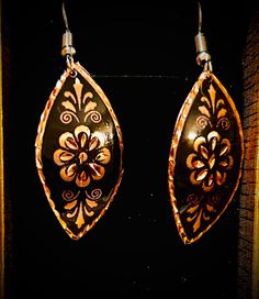 Elegant, handcrafted, cooper engraved Turkish earrings from Istanbul.  These Turkish handmade earrings are a perfect gift for someone special. Crafted from high-quality copper, they feature an intricate engraving that adds a touch of beauty to any outfit. The earrings are perfect for those who appreciate unique and exquisite jewelry pieces. The earrings are designed with a focus on beauty and elegance, making them a great addition to any jewelry collection. The engraved design adds a touch of so Traditional Pierced Flower Jewelry, Ornate Bronze Earrings For Gift, Handmade Copper Flower Earrings, Artisan Metal Earrings Perfect As A Gift, Artisan Metal Earrings For Gift, Handmade Copper Gold Flower Earrings, Vintage Copper Pierced Jewelry, Elegant Etched Metal Earrings, Handmade Gold Flower Earrings In Copper