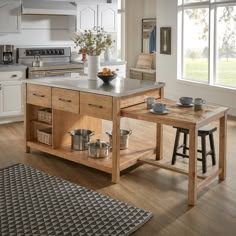 a kitchen island with two stools in front of it and pots on the counter