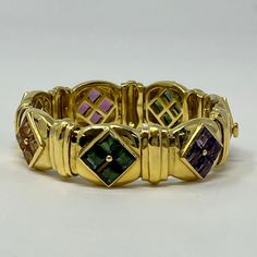 18K Gold Bracelet with Square Cut Pink and Green Tourmaline, Iolites and Citrines (includes appraisal, Value: $20,000) Designer = Jewelry Material = 18K Gold Gemstone = Tourmaline Condition = Excellent Class = Premier Location: Wilmette Item Number: 11405-1381 Item ID: 287626 Category: Bracelet 18k Gold Bracelet, Square Cut, Green Tourmaline, Designer Jewelry, Item Number, Tourmaline, Pink And Green, Gold Bracelet, 18k Gold