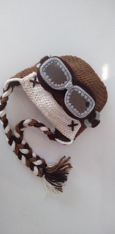 a crocheted hat with sunglasses on it