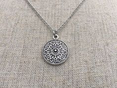 This is a understated and elegant little boho disc pendant necklace.  It is perfect for everyday wear and would go with just about anything.  The disc measures 3/4” long by 5/8” wide and is made from allergy free plated silver.  It hangs from a simple stainless steel necklace chain.I have matching earrings in my shop, if you would like the whole set.  Here is the link.......... https://etsy.me/2VZ551y Thanks for stopping by!  Please take a moment and visit the rest of my Etsy shop.    I have man Bohemian Charm Necklace With Round Pendant For Gifts, Silver Delicate Chain Jewelry For Festivals, Bohemian Silver Charm Necklace For Gift, Bohemian Silver Charm Necklace As Gift, Silver Bohemian Charm Necklace As Gift, Bohemian Jewelry With Delicate Chain For Gift, Bohemian Round Charm Necklaces, Handmade Bohemian Disc Jewelry, Handmade Bohemian Round Disc Jewelry