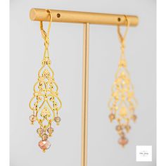 Add a touch of elegance and romance to your look with these stunning Amber glass filigree dangle earrings. The shimmering, faceted amber glass beads perfectly complement the lovely gold-plated filigree and lever backs, creating a lightweight and secure fit. Enhance your outfit with the timeless beauty of Amber glass filigree dangle earrings. The delicate filigree detailing and sparkling amber glass beads add a touch of sophistication and romance to any ensemble. These earrings, measuring at 2.75 Artisan Rings, Filigree Earrings, Boho Chic Style, Gemstone Jewelry Handmade, Gold Filigree, Bright Gold, Rings Bracelets, Amber Glass, Handmade Artisan