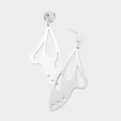 two pairs of white metal earrings with tears on the bottom and one earring hanging from