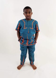 Boys African Traditional outfit. Add to your child's wardrop our boys Eva African - print ,made with 100% cotton poplin Ankara -African wax. Vibrant and stylish.  Features of this Boys African clothing  Short sleeve buttoned chest waist rubber band  2 side pockets  Big fashion , little prices.  Care Instruction: HAND WASH COLD. MILD DETERGENT. DO NOT BLEACH. HANG TO DRY. Boys Ankara Outfits, Kitenge Tops, Ankara Outfits, Outfit Short, Traditional Outfit, Kitenge, Fashion Couture, Boys Set, Big Fashion