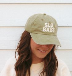 The Slo Babe Hat is perfect for the laidback individual. Crafted from 100% cotton twill, the unstructured, low-profile hat features a garment washed, pigment-dyed finish for a lived-in look. The slide closure with brass buckle and grommet ensures a secure fit. Get a comfortable, casual look with the Slo Babe Hat. Fabric: 100% cotton twill Structure: Unstructured Profile: Low Closure: Self-fabric slide closure with silver buckle and grommet Soft-washed Summer Baseball Cap, Trendy Soft-washed Snapback Hat, Trendy Soft-washed Cap, Cotton Baseball Cap With Short Brim For Spring, Short Brim Cotton Baseball Cap For Spring, Pre-washed Cotton Dad Hat With Curved Bill, Trendy Adjustable Soft-washed Hat, Pre-washed Cotton Dad Hat, Pre-washed Cotton Dad Cap