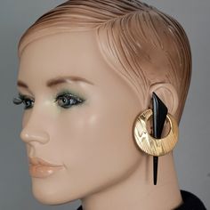 Features: - 100% Authentic JEAN LOUIS SCHERRER. - Massive geometric Art Deco inspired earrings with black resin accent. - Gold tone hardware. - Signed SCHERRER PARIS. - Clip back earrings. - Minor hairline scratches. - Excellent vintage condition. Measurements: Height: 3.54 inches (9 cm) Width: 1.77 inches (4.5 cm) Weight per Earrings: 19 grams **These earrings will be shipped via DHL Express Shipping with tracking number. Please convo me for any queries and additional photos. Thank you for visi Black Retro Earrings, Bold Black Drop Earrings, Bold Geometric Designed Earrings, Bold Geometric Earrings With Bold Design, Modern Plug Earrings For Party, Modernist Black Earrings As Gift, Modernist Black Earrings For Gift, Modern Black Geometric Earrings, Bold Geometric Earrings