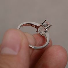 This is a gorgeous handmade creation. Its beauty is its simplicity & Elegance. The 6*8mm cushion cut shape faceted morganite is crafted in solid sterling silver and with rhodium plated. All item is sent in a beautiful gift box You can realize more lovely stuff clicking the link https://www.etsy.com/shop/knightjewelry?refshopsection_shophome_leftnav Please leave the correct address and you phone number for delivering successfully. Asscher Cut Gemstone Promise Ring, Radiant Cut Morganite Wedding Jewelry, Classic Morganite Cushion Cut Rings, Formal Cushion Cut Morganite Jewelry, Radiant Cut Crystal Promise Ring With Prong Setting, Sterling Silver Diamond Cut Topaz Promise Ring, Sterling Silver Diamond Cut Topaz Ring For Promise, Cushion Cut Morganite Jewelry With Center Stone, Radiant Cut Crystal Ring With Prong Setting For Gift