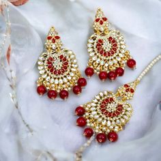 This Hight Quality Pakistani Mirrored Earrings and Maang Tikka Set are the ultimate in versatile  Indian jewelry. Wear them together or Tikka and Earrings Their own. you can create three different looks with one set. Choose from two colors: Mint and Red Earrings drop Lenth: 10cm width: 5.5cm Tikka Drop 9cm approx This gorgeous pair is made on brass as base metal and handcrafted to perfection with studded white beads, Kundan stones, and blush onyx beads. you don't have to opt for the minimalistic all the time. Sometimes it's better to go OTT. Maang Tikka Set, Chandbali Earrings, Maang Tikka, Kundan Earrings, Nose Jewelry, Onyx Bead, Red Earrings, Plus Ultra, Earrings Drop