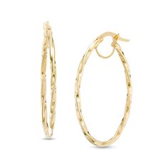 An unexpected twist on a classic look, these striking hoop earrings are quite enticing. Crafted in warm 14K gold, each 36.0 x 24.0mm oval-shaped hoop features a graceful twist for a style that's surprising yet pleasing. Polished to a bright shine, these earrings secure with hinged backs. Twist Hoop Earrings, 50 Fashion, Earring Backs, Designer Earrings, Classic Looks, Fashion Earrings, Types Of Metal, Gold Metal, Gold Bracelet