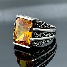 Elevate your style with this stunning yellow citrine stone ring, meticulously handcrafted in Turkey. Featuring a raw gemstone set in a 925k sterling silver band, this ring exudes natural beauty and timeless elegance. The vibrant yellow hues of the citrine stone are sure to captivate, while the raw, unpolished form adds an organic touch. Crafted by skilled artisans, this ring is a testament to Turkish craftsmanship. Whether as a gift for him or a treat for yourself, this citrine sterling silver ring is a luxurious accessory that will make a statement. Embrace the allure of nature's brilliance with this exquisite handmade piece. Emerald Stone Rings, Mystic Topaz Ring, Raw Gemstone Ring, Malachite Rings, Engraved Wedding, Yellow Citrine, Citrine Stone, Mystic Topaz, Leather Cuffs Bracelet