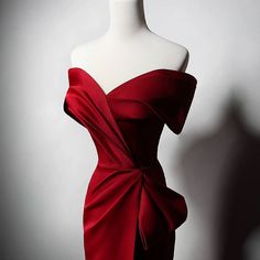 Embrace elegance with our Off-the-Shoulder Red Satin Evening Dress with Bow Detail. This stunning evening gown is crafted from luxurious red satin that drapes beautifully, creating a flattering silhouette. The off-the-shoulder design and exquisite bow detail add a touch of romantic sophistication, perfect for weddings and other special occasions. Designed to accentuate your curves, this form-fitting gown flows gracefully to the floor, ensuring a memorable entrance. Available in plus sizes, this dress ensures every woman feels confident and glamorous. Perfect for weddings, galas, and elegant events, this Off-the-Shoulder Red Satin Wedding Dress is ideal for making a statement. Embrace your unique style and shine in this exquisite red evening gown. Red Satin Finish Evening Dress For Prom, Gala Evening Dress With Satin Finish, Red Satin Dress For Prom Season, Red Floor-length Satin Evening Dress, Red Off-shoulder Evening Dress With Fitted Bodice, Red Satin Dress For Prom, Satin Finish Evening Dress For Gala, Satin Finish Evening Dress For Galas, Red Satin Finish Floor-length Dress