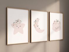 three framed pictures hang on the wall next to each other, with flowers in their hair