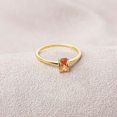 Citrine stone is believed to bring abundance, fertility and money for centuries. Our 14k solid gold and rectangular cut citrine ring is suitable for daily use with its special design and will be your indispensable jewel that you can use on your special days. A stylish jewel for you and your loved ones. Time to pamper yourself and your loved ones... Citrine is the birthstone for those born in November. 🤍🤍 Special gifts for your special moments. We produce our jewelry in the most perfect way for Classic Topaz Birthstone Ring For Gift, Elegant Topaz Jewelry With Rectangular Stone, Elegant Topaz Rings With Rectangular Stone, Elegant Rectangular Topaz Stone Jewelry, Elegant Rectangular Topaz Jewelry, Formal Birthstone Ring With Rectangular Stone, Elegant Citrine Birthstone Crystal Ring, Elegant Citrine Crystal Ring With Birthstone, Gift Topaz Ring With Prong Setting And Rectangular Stone