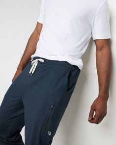 A fresh take on athleisure and a staple in your wardrobe, the Sunday Performance Joggers are premier in fit, function and soft stretch. This jogger style will keep you moving with less bulk around your ankles. | Vuori Sunday Performance Jogger Pants | Ink Heather | Medium Vuori makes premium performance apparel inspired by the active Coastal California lifestyle; an integration of fitness, surf, sport, and art. Breaking down the boundaries of traditional activewear, we are a new perspective on p Athleisure Comfort Stretch Tapered Leg Joggers, Sporty Tapered Leg Sweatpants With Comfort Stretch, Sporty Joggers With Comfort Stretch And Tapered Leg, Athleisure Sweatpants With Tapered Leg And Elastic Panels, Functional Relaxed Fit Joggers With Elastic Side Panels, Relaxed Fit Joggers With Elastic Side Panels, Functional Joggers With Relaxed Fit And Elastic Side Panels, Athleisure Joggers With Comfort Waistband And Tapered Leg, Relaxed Fit Go-dry Joggers