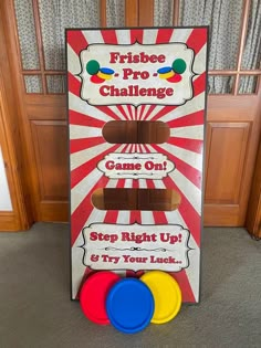 a game board with three frisbees in front of it