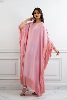 Featuring: Silk fringe Satin fabric Butterfly sleeve caftan Luxurious fringe sleeves and hem Free size Fabric:Fringes - 100% Silk.Bodice Fabric - 100% Satin.Color: PinkBrand: Unmatched BYU Size: Free size. (Fits between size 2 US up to size 20 US).Length: 47 inches.This caftan is available in multiple colors Party Dresses With Tassels For Eid, Party Dress With Tassels For Eid, Tassel Dress For Eid Party, Fringe Floor-length Maxi Dress, Elegant Long Sleeve Kaftan With Tassels, Evening Kaftan With Tassels, Spring Maxi Kaftan With Tassels, Bohemian Tassel Dress For Eid, Spring Fringe Tunic Dress