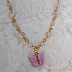 Rose Quartz And Glass Crystal Beaded Gold Choker Necklace With Pink Butterfly Charm Measures Approximately 14" And Is Finished With A Gold Toned Stainless Steel Chain With A Lobster Clasp And 1.5" Extension Chain. Pink Dainty Necklace With Beaded Chain, Trendy Pink Crystal Necklaces As Gift, Trendy Pink Crystal Necklaces For Gifts, Dainty Pink Beaded Necklaces For Gifts, Trendy Pink Crystal Necklace For Gift, Dainty Pink Beaded Necklace For Gift, Rose Quartz Beaded Necklaces For Gift, Dainty Pink Beaded Crystal Necklaces, Feminine Pink Crystal Necklace As Gift