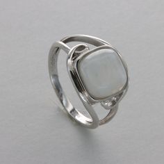 These is a beautiful pair of Sterling Silver R ing with a Rainbow Moonstone Gemstone. The ring are made out of solid 925 Silver and there is no nickel or other substances causing most allergies. This makes the ring hypo allergenic. Size of the Moonstone 1.0 x 1.0 cm or  0.39 x 0.39 inch Please note: Our jewelry is photographed close up to show detail and may appear larger than they are. We use a dime coin as size reference on one of the pictures. You will receive the item in a gift box - perfect Silver Sterling Crystal Ring With Accent Stones, Silver Crystal Ring With Accent Stones In Sterling Silver, Silver Gemstones With Polished Finish, Silver Opal Ring With Accent Stones For Gift, Elegant Sterling Silver Moonstone Ring For Anniversary, Fine Jewelry Silver Hallmarked Moonstone Ring, Sterling Silver Pearl Ring With Polished Finish, Fine Jewelry Sterling Silver Moonstone Ring With Accent Stones, Polished Silver Gemstones For Anniversary