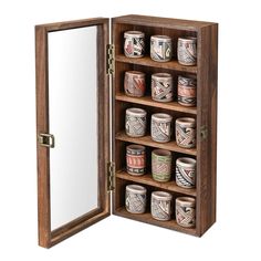 an open wooden box with many jars in it and a mirror on the wall behind it