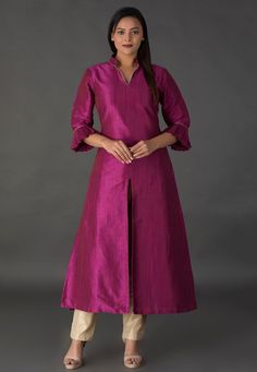 Art Silk Front Slit Kurta in Magenta. This Readymade attire with Cotton Lining is Crafted in Chinese Collar Neck and Quarter Sleeve. Available with a Dupion Silk Pant in Beige. The Top and Bottom Lengths are 50 and 40 inches respectively. Do Note: Accessories shown in the image are for presentation purposes only. Half to one inch may vary in measurement. (Slight variation in actual color vs. image is possible.)  We sell all kinds of women's and ladies tops Casual Kurtas |Indian Tops |Gowns |Ladi A Line Kurti Designs, Salwar Neck Patterns, Silk Dress Pattern, Collar Kurti Design, Plain Kurti Designs, Collar Kurti, Plain Kurti, Silk Dress Design, Long Blouse Designs