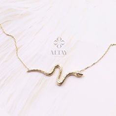 "ABOUT PRODUCT This 14K Gold Snake Necklace is suitable gift for girlfriend, mom and her. You can even buy as a birthday gift for your friends or anniversary gifts, If you want to add a special note we can write for you and put to inside of package. We manufacture our jewelry pieces with carefully and after production we double checking in quality control department. Our main idea is keep our items for daily wearing especially for minimalist jewelry pieces. Minimalist pendant, Cute pendant, Cust Snake-shaped Jewelry Gift, Handmade Snake Shape Necklace For Gift, Handmade Snake Shape Necklace Gift, Handmade Snake-shaped Necklace For Gift, Handmade Snake Necklace For Gifts, Snake Shape Clavicle Chain Jewelry As A Gift, Dainty Snake Shape Necklace For Gift, Dainty Snake-shaped Necklace For Gift, Gift Snake Chain Jewelry With Clavicle Chain