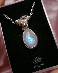 Handmade Rainbow Moonstone necklace.Made with solid silver 999 wire and natural Moonstone stone.there is a silverplated chain to the necklace (45 cm long).This jewel is very elegant and feminine and would make a beautiful gift for a loved one. A stone for "new beginnings", Moonstone is a stone of inner growth and strength. It soothes emotional instability and stress, and stabilises the emotions, providing calmness. Moonstone enhances intuition, promotes inspiration, success and good fortune in l Silver Moon-shaped Crystal Necklaces With Gemstone, Silver Moon Phase Pendant Crystal Necklace, Silver Crystal Moon Phase Pendant Necklace, Silver Moon-shaped Crystal Necklace With Gemstone, Silver Pendant Crystal Necklace With Moon Phase, Silver Moon-shaped Sterling Silver Crystal Necklace, Moon-shaped Sterling Silver Crystal Necklace, Silver Sterling Silver Moon Crystal Necklace, Sterling Silver Moon Phase Pendant Crystal Necklace