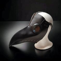 Exquisite Steampunk Plague Doctor Mask Design Features Faux Leather Construction In Matte Black With Air Holes Along The Bottom On Both Sides And Blue Tinted, Oversized Eye Domes Easy To Wear Over Glasses Ventilation Holes Make It Easy To Breathe Comfortably Adjustable Head Straps High Quality, Studded Assembly Makes It Durable Will Fit All Head Sizes Lays Flat For Convenient Storage Ideal For Gothic Medieval Cosplay And Halloween Costume Ensembles Soft, Inner Side Easy On The Skin Nwot, New, Ne Cyberpunk Halloween Costume Accessories, Steampunk Halloween Cosplay Costume Accessories, Black Novelty Masks And Prosthetics For Costume, Black Steampunk Cosplay Costume, Gothic Black Cosplay Costume For Alternative Fashion, Black Gothic Cosplay Costume For Alternative Fashion, Black Novelty Mask, Black Punk Cosplay Costume For Party, Black Punk Cosplay Costume