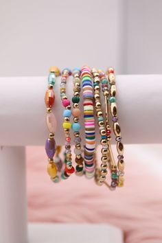 Enhance your accessory game with our Gold Mixed Up Multicolored Beads Bracelet Set. This set features a mix of gold and multicolored beads for a unique and stylish look. Perfect for any occasion, you'll love the versatility and eye-catching design of this set. Elevate your style with this must-have accessory. Size: 6.5” - Inner Diameter Closure: Elastic Material: Zinc, Brass and Steel with Rhodium Plating Lead and Cadmium Safe - It is not Nickel Free Gold Friendship Bracelets For Jewelry Making With Colorful Beads, Multicolor Metal Beaded Bracelets, Bohemian Multicolor Friendship Bracelets With Gold Beads, Adjustable Multicolor Jewelry With Gold Beads, Trendy Multicolor Friendship Bracelets With Tiny Beads, Gold Bangle Friendship Bracelets With Colorful Beads, Multicolor Stackable Beaded Bracelets For Party, Trendy Gold Beaded Bracelets With Heishi Beads, Multicolor Friendship Bracelets With Colorful Beads