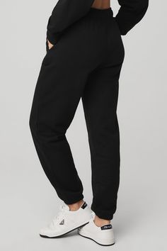 We’re all about the Accolade Sweatpant — it’s a super soft, leveled-up classic with a chrome Alo logo detail and powerful, performance tech for studio & street. Wear it in cold weather with a bold jacket and transition to warmer weather with slides. Super-soft diagonal French terry For chill time or to-and-from Designed to work from studio to street Wear-tested by our in-house team for the perfect fit Accolade Sweatpant in Black, Size: XL | Alo Yoga® Sporty Cotton Bottoms By Alo Yoga, Alo Yoga Bottoms With Ribbed Waistband, Black Sweatpants With Elastic Cuffs For Leisure, Black Joggers With Elastic Waistband For Loungewear, Black Athleisure Joggers For Lounging, Black Activewear With Elastic Waistband For Lounging, Black Activewear For Lounging, Black Activewear For Lounging With Elastic Waistband, Comfortable Cotton Bottoms By Alo Yoga