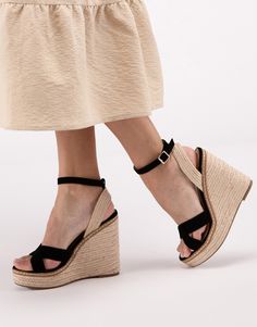 Introducing SODA’s Basset Angle Strap Espadrille Wedges, the perfect blend of classic style and comfort for your summer wardrobe. These Criss Cross Ankle Strap Espadrille Platform Wedge Sandals are designed to elevate your look while keeping you comfortable all day long. With their chic criss-cross strap design, they add a touch of elegance to any outfit. The ankle strap provides extra support and security, while the espadrille platform wedge sole adds height and style.PRODUCT SPECIFICATIONS:*Silhouette: Wedge Sandal*Criss Cross Front Strap*Buckle Ankle Closure*Heel Height: 5"*Features faux suede, faux nuback and faux leather*Brand: SODA*Online Only Espadrilles Platform, Black Wedge Sandals, Chunky Beads, Shoes Outfit, Strap Shoes, Platform Wedge Sandals, Platform Wedge, Strap Design, Coin Pendant