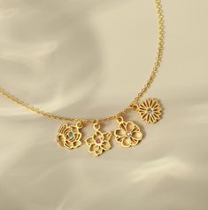 "Surprise mom with our exquisite Birth Flower Bouquet Necklace, a truly meaningful gift on Mother's Day. Each delicate flower charm is adorned with a shimmering birthstone. Perfect for Mother's Day or Christmas, this elegant necklace encapsulates the beauty of family ties and cherished memories. A timeless keepsake, it reflects the love, joy, and connection shared within the family. ► PRODUCT INFORMATION * Material: High Quality Solid 925 Sterling Silver * Finishing: Silver, Gold-plated, Rose gold-plated * Dimension:  Birth flower measure approx 9-10mm * Maximum 8 birth flowers each necklace * All of our jewelry are handmade from scratch and packaged with care in our workshop. * Product is safe for sensitive skin. ► HOW TO ORDER & ADD PERSONALIZATION * Select your preferred color, necklace Gold Flower Charm Necklace With Birthstone, Gold Flower-shaped Charm Necklace With Birthstone, Gold Flower Pendant Birthstone Necklace For Anniversary, Gold Birthstone Necklace With Flower Pendant For Anniversary, Birthday Jewelry With Flower Charm, Flower Charm Jewelry For Birthday, Birthday Flower Charm Jewelry, Mother's Day Flower Pendant Charm Necklace For Anniversary, Flower Pendant Charm Necklace For Mother's Day Anniversary