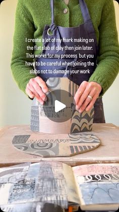 a woman is making a paper hat out of cardboard