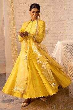 Lemon yellow organza jacket with floral embroidered motifs and front tassel tie-up. Paired with Chanderi sleeves, mukaish work anarkali and Chanderi pant, organza dupatta.
Component: 4
Embroidered
Neckline: Mandarin
Sleeve Length: Full
Fabric: Shantoon, Organza,Chanderi Mukaish, Chanderi
Color: Yellow
Gota, muskaish work
Striped pant
Tassel dupatta
Scallop border - Aza Fashions Tassel Dupatta, Mukaish Work, Organza Jacket, Scallop Border, Striped Pant, Embroidered Motifs, Organza Dupatta, Embroidered Neckline, Embroidered Jacket