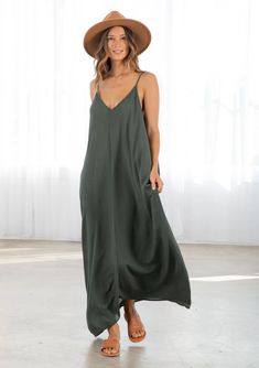 Dark Green Colored Tank Top style Maxi Dress. With pockets attached Unlined V-neck Maxi Dress For Beach, V-neck Maxi Sundress For Day Out, Chic V-neck Rayon Maxi Dress, Spring V-neck Maxi Dress For Date Night, Chic Summer Maxi V-neck Dress, V-neck Slip Dress For Summer Loungewear, Casual V-neck Maxi Dress For Date Night, Floor-length V-neck Dress For Beach In Summer, Floor-length V-neck Beach Dress For Summer