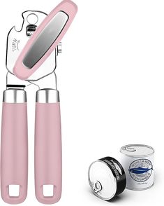 two pink kitchen utensils next to an ice cream container and can openers