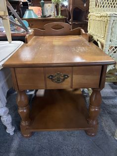 a wooden table with drawers on top of it